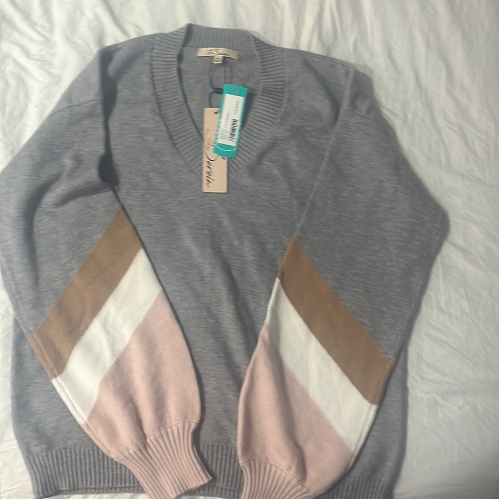 Grey v-neck sweater with pink,cream,tan stripe on arms